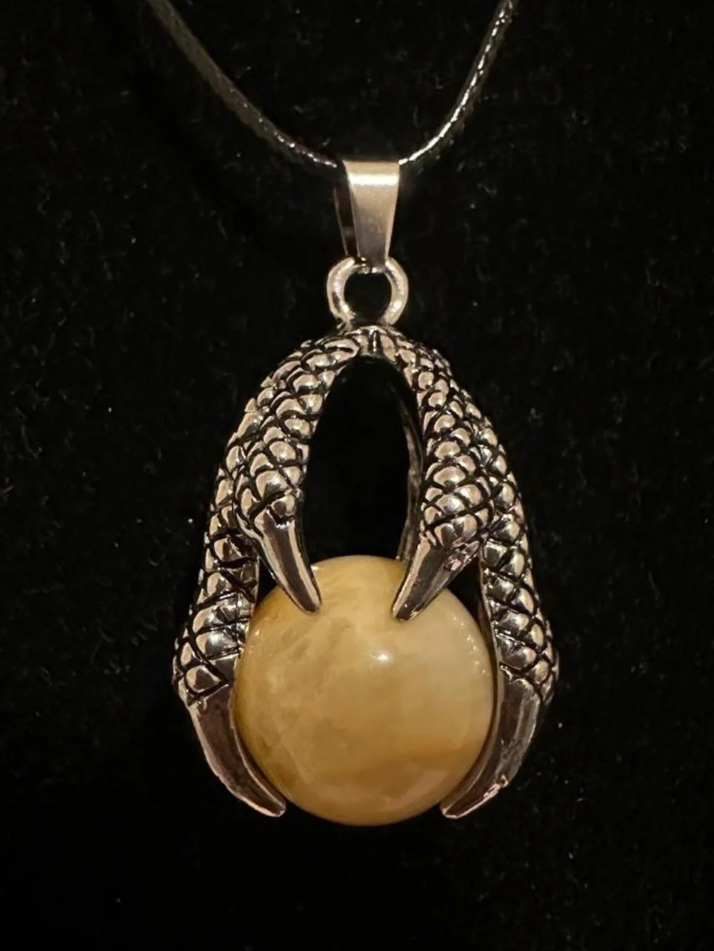 Silver dragon claw pendant necklace with big yellow aventurine crystal ball.